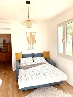 a bedroom with a bed in a room at Chalet Elli's Mountain View in Velje Selo
