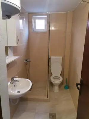 a bathroom with a toilet and a sink at Oliva apartment in Petrovac na Moru