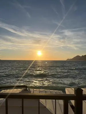 a view of the ocean from the deck of a boat at Kolibri Apartment in Dobra Voda