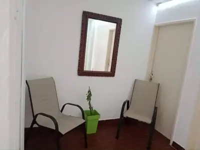 two chairs and a mirror in a room at Apartmani Dream 3 in Bar, Susanj