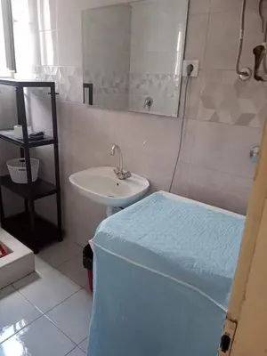 a bathroom with a bed and a sink and a tub at Apartmani Dream 3 in Bar, Susanj