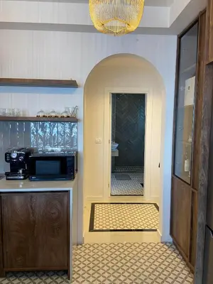 a kitchen with a sink and a microwave in a room at Palastura Apartments in Ulcinj
