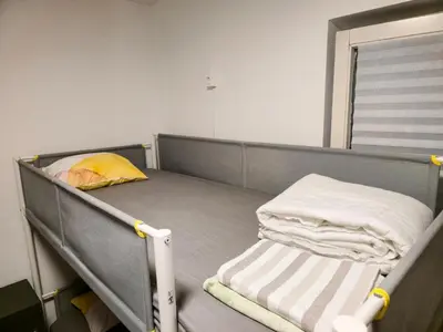 a hospital bed with two mattresses on it at Hostel Budva in Budva