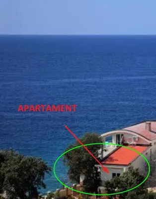 an aerial view of a house near the ocean at Apart Yukka first line in Utjeha