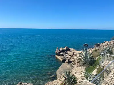 a view of the ocean from a rocky shore at Apart Yukka first line in Utjeha