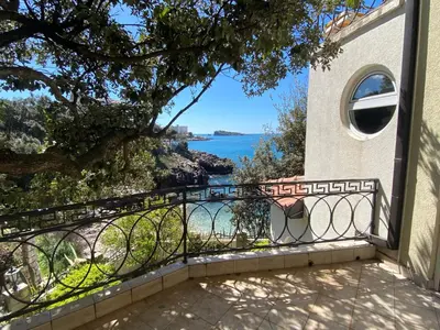 a balcony with a view of the ocean at Apart Yukka first line in Utjeha