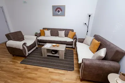 a living room with two couches and a coffee table at Elegant Escape Podgorica in Podgorica