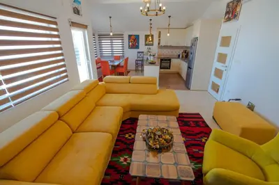 a living room with a couch and a table at Mantra HOME in Bar