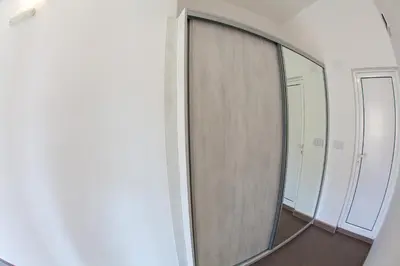 a mirror on a wall in a room at Apartments Vila Masha in Petrovac na Moru