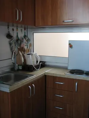 a kitchen with a sink and a counter top at Guest House Ivo Jovanovic in Sveti Stefan