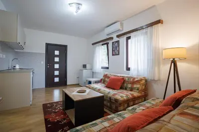 a living room with a couch and a table at Oasis of Peace Meterizi in Cetinje