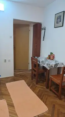 a living room with a table and two chairs at Apartman Vesna Budva 1 in Budva