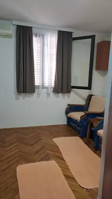 a living room with two rugs on the floor at Apartman Vesna Budva 1 in Budva