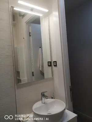 a bathroom with a sink and a mirror at Život je tren in Podgorica
