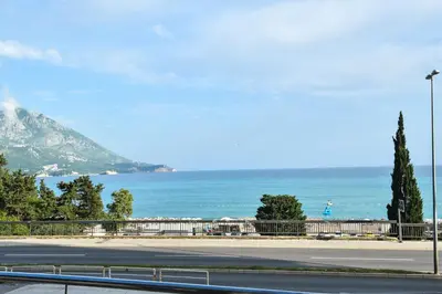 an empty road with a view of the ocean at La splendida in Becici