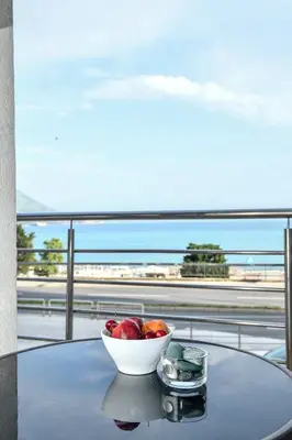 a bowl of fruit on a table with a view of an airport at La splendida in Becici