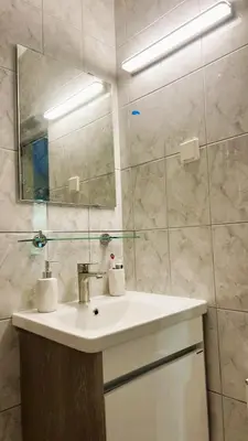 a bathroom with a sink and a mirror at Villa M in Becici