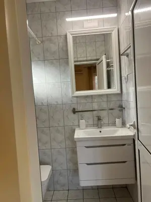 a bathroom with a sink and a mirror at Villa M in Becici