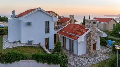 a villa with a view of the ocean at Carsko Selo Budva Blizikuce Soppp in Ðenaši