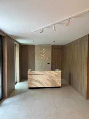 a lobby with a reception desk in a building at Giardino Onia Apartment in Budva