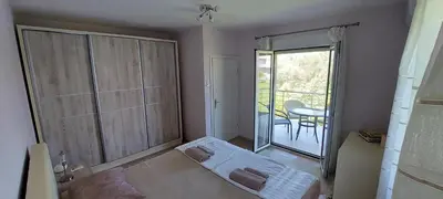 a small room with a balcony with a sliding glass door at Apartment Diki in Bar