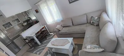 a living room with a couch and a table at Apartment Diki in Bar