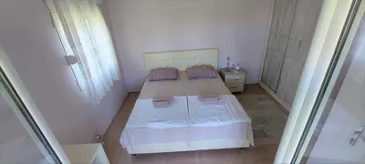 a small bedroom with a bed in a room at Apartment Diki in Bar
