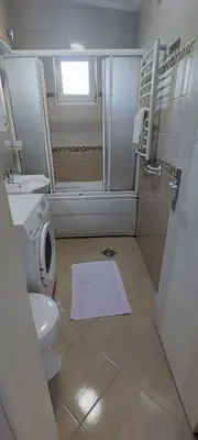 a bathroom with a toilet and a shower and a sink at Apartment Diki in Bar