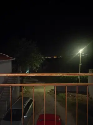 a view of a street light at night at Bgd 2 apartman in Kotor
