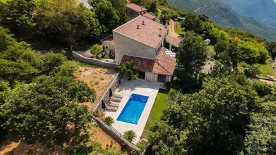 an aerial view of a house with a swimming pool at Villa Brda in Petrovac na Moru