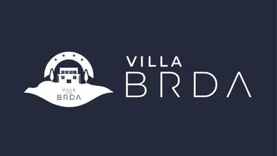 a logo for the britannica river with a lighthouse at Villa Brda in Petrovac na Moru