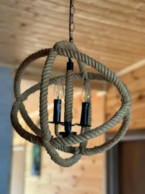 a chandelier made of ropes hanging from a ceiling at Kućica Ušće - Ada Bojana in Ulcinj
