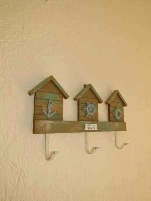 two wooden bird houses on a wall at Seas the day - Apartment with sea view and terrace in Ulcinj