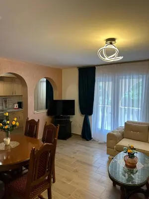 a living room with a table and a couch at Villa IL Mare in Budva