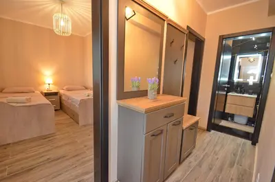 a room with a room with a bathroom and a bedroom at Apartments Orizzonte with beautiful view of the bay in Kotor