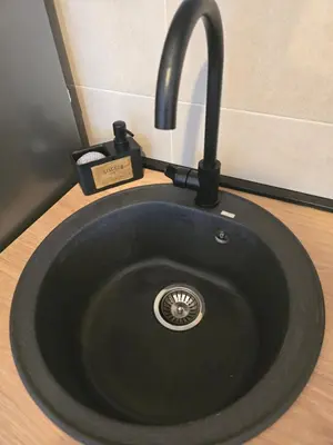 a black sink with a faucet in a bathroom at Apartman Cetinje in Cetinje