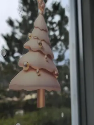 a plastic christmas tree ornament on a window at Apartman Cetinje in Cetinje