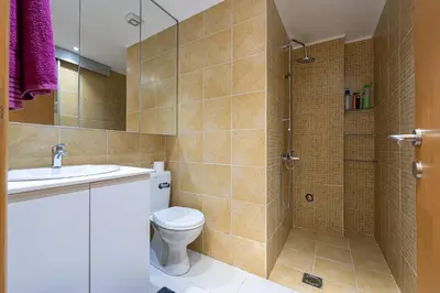 a bathroom with a toilet and a shower at Hillside Apartments in Becici