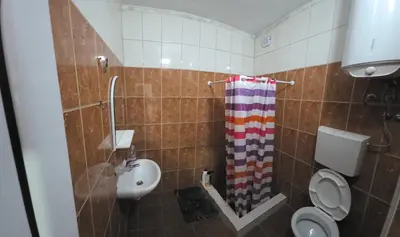 a bathroom with a toilet and a sink at Blazo apartments in Ulcinj
