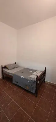 a bed in the corner of a room at Blazo apartments in Ulcinj