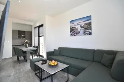 a living room with a couch and a table at Residenza Apartments in Kotor