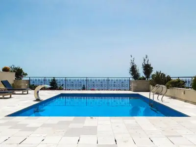 a swimming pool with a fence around it at Casa Oliva Villa with private heating pools in Budva
