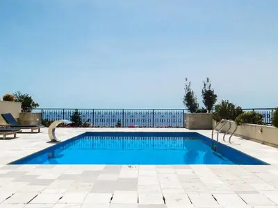 a swimming pool with a fence around it at Casa Oliva Villa with private heating pools in Budva