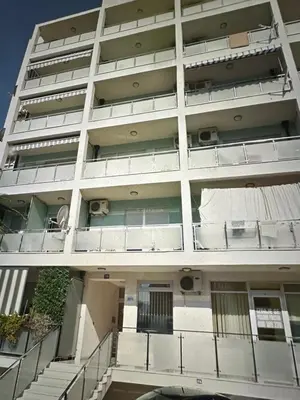 an apartment building with stairs in front of it at Apartment Studio in Budva