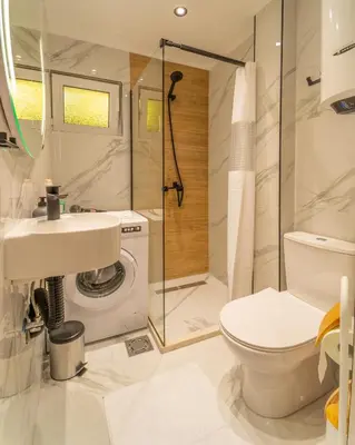 a bathroom with a toilet sink and a shower at ELIT APARTMENTS Budva in Budva