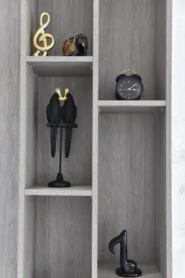 a shelf with two boxing gloves and a clock at ELIT APARTMENTS Budva in Budva