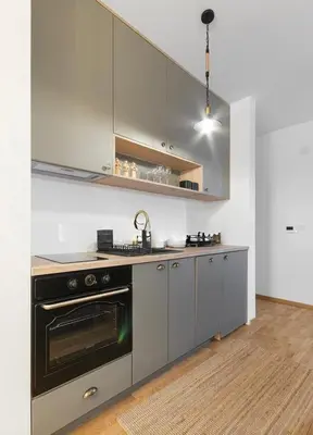 a kitchen with stainless steel appliances and a stove at Anja Apartment in Becici