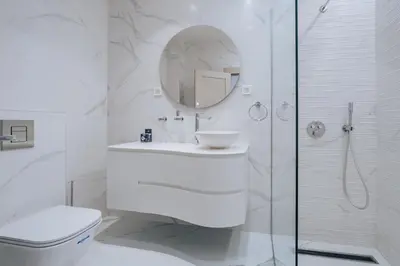 a white bathroom with a sink and a shower at Villa Principium with Infinity Edge Pool&Hot Tub in Kotor