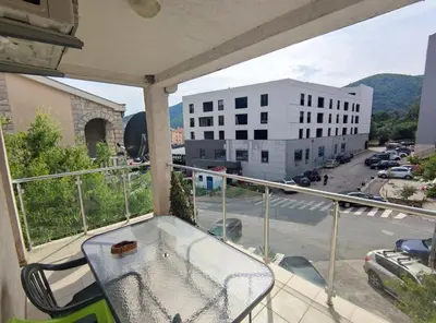 a balcony with a view of a parking lot at Fun and spacious apartment in Budva