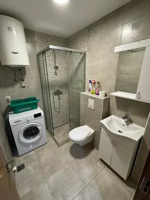 a bathroom with a shower and a toilet and a sink at Studio Marovic in Ulcinj